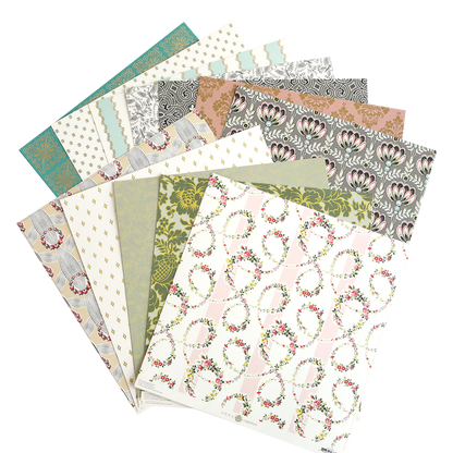 The Classic 12x12 Cardstock is a collection of decorative sheets featuring intricate floral, geometric, and patterned designs, arranged in a fan-like display—perfect for adding elegance to your scrapbooks.