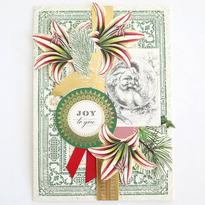 The Christmas Engravings Cards and Toppers Bundle features a decorative holiday card adorned with red and white flowers, pine branches, a Santa illustration, and a round label reading “Joy to you.” Accented with ribbons on a vintage-style background, this bundle is perfect for expanding your festive Christmas card collection or using as card toppers for creating custom holiday stationery.