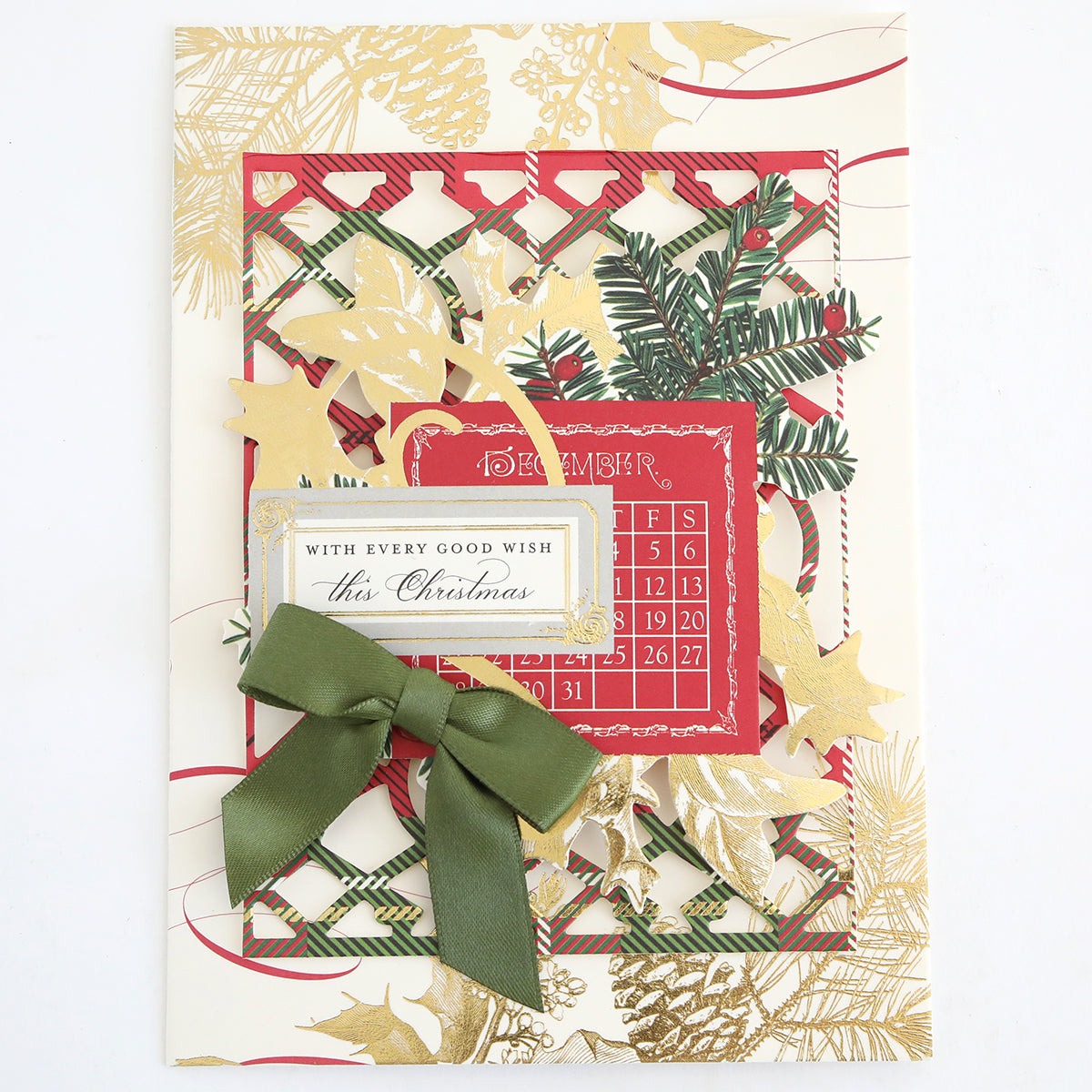 This Christmas card features the Christmas Engravings Collage Card Toppers, beautifully accented with gold and green foliage, a green ribbon bow, and a red Advent calendar. The front showcases the heartfelt message: “With every good wish this Christmas.” Perfect for those who appreciate handmade designs, these festive cardstock toppers add an elegant seasonal touch to your card.
