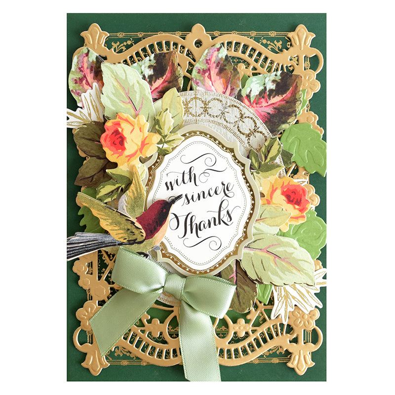 Greeting card adorned with an ornate gold border, green ribbon bow, autumn-inspired floral and leaf decorations, a charming bird illustration, and the sentiment “with sincere Thanks” at the center. Completed with Foliage Stickers and 3D embellishments for enhanced dimension and appeal.