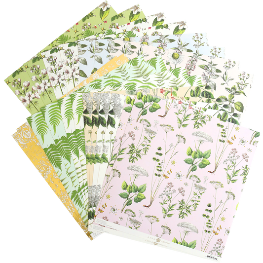 Botanical 12x12 Cardstock arranged in a fan shape, featuring green and pink antique-inspired floral designs.