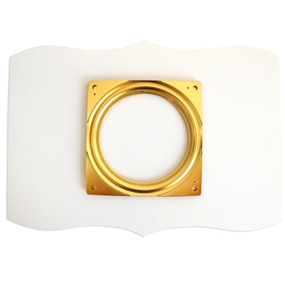 A square gold metal ring on a wavy-edged white background brings the Empress Lazy Susan's elegance to your table, ideal for accenting plate storage or enhancing an ivory turntable display.