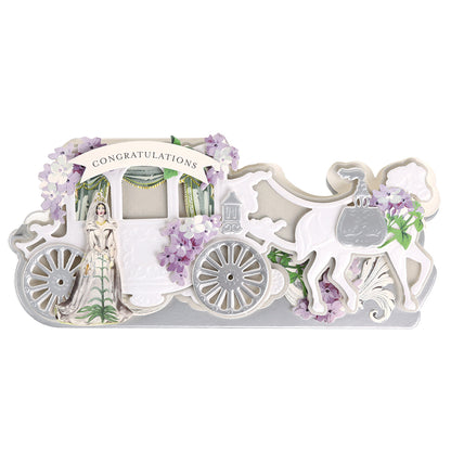 A beautiful white horse-drawn carriage adorned with flowers and a “Congratulations” banner—complete with a bride inside—serves as the perfect inspiration for wedding card creations using the Carriage Slimline Easel Card Dies.