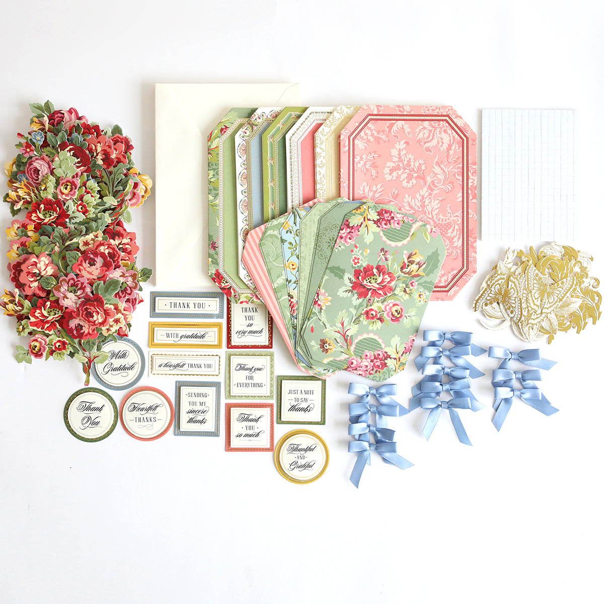 Simply Thank You Card Making Kits containing floral die-cut accents, patterned card bases, envelopes, ribbon bows, and sentiment tags for creating handmade cards.