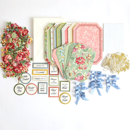 Simply Thank You Card Making Kits containing floral die-cut accents, patterned card bases, envelopes, ribbon bows, and sentiment tags for creating handmade cards.