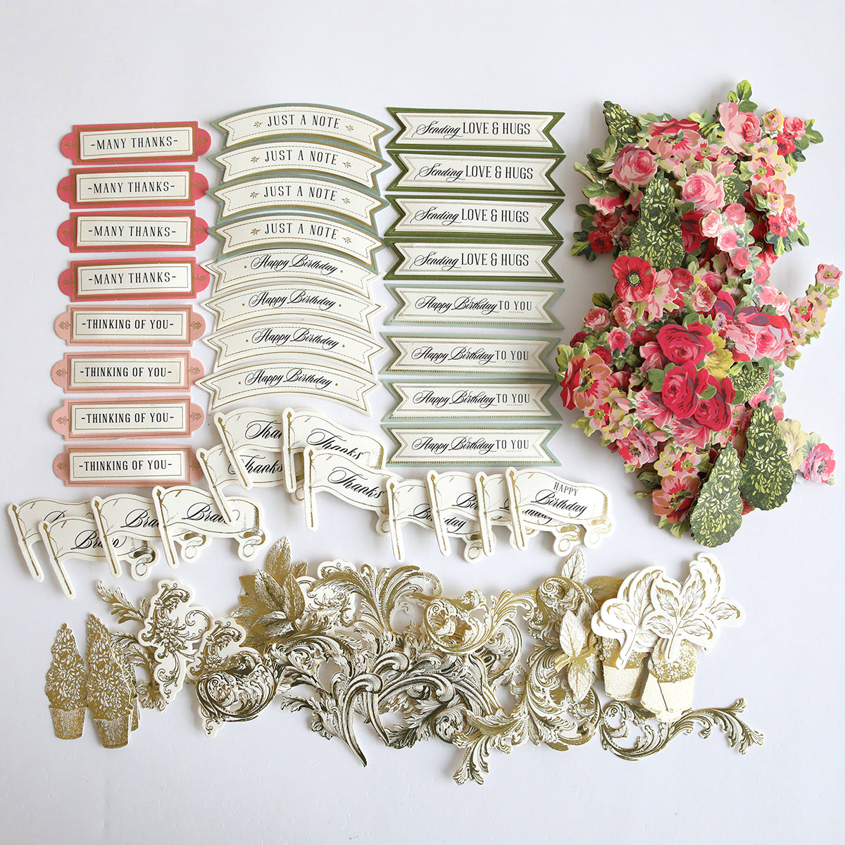 A collection of paper flowers and other decorations including Garden Fountain Embellishments.