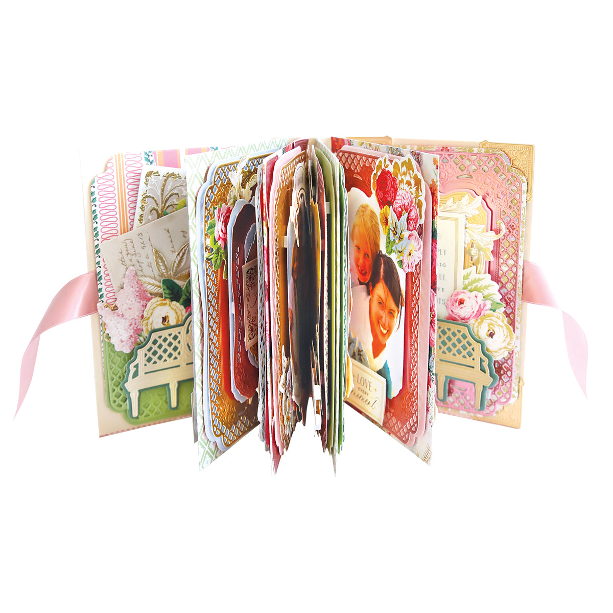 An open book with pictures and ribbons, perfect for preserving cherished memories using Anna Griffin's Trellis Album Class Materials and Dies.