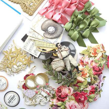 A variety of Beautiful Birthday Class Materials and Dies, including 3D dies, are laid out on a table.
