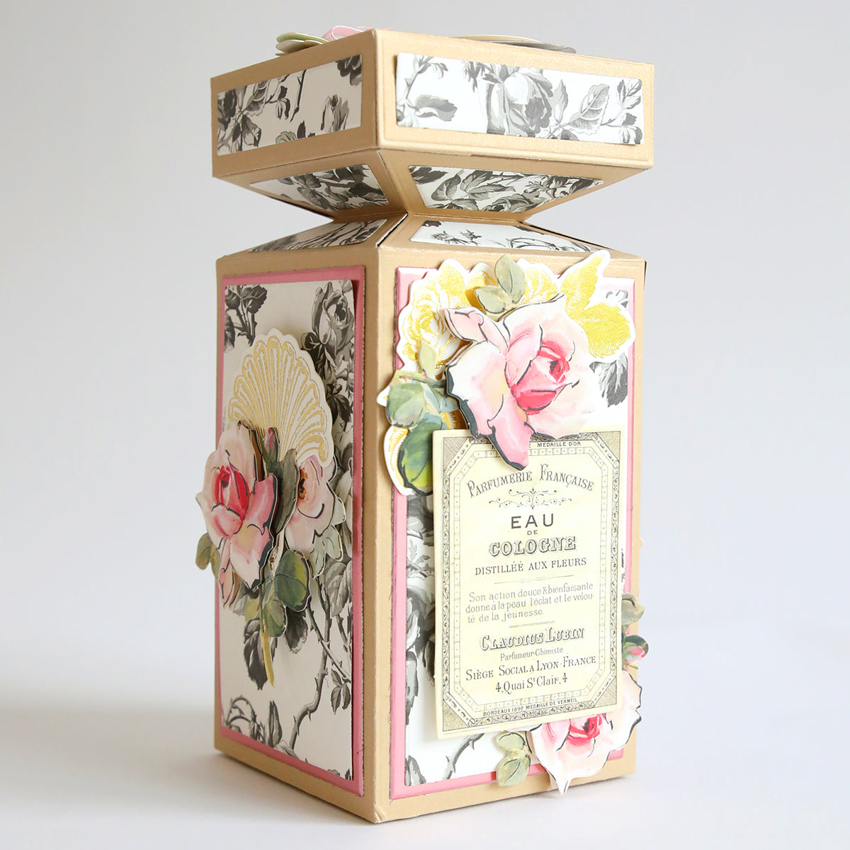 A gift-wrapped Anna Griffin Perfume Box adorned with roses and flowers.