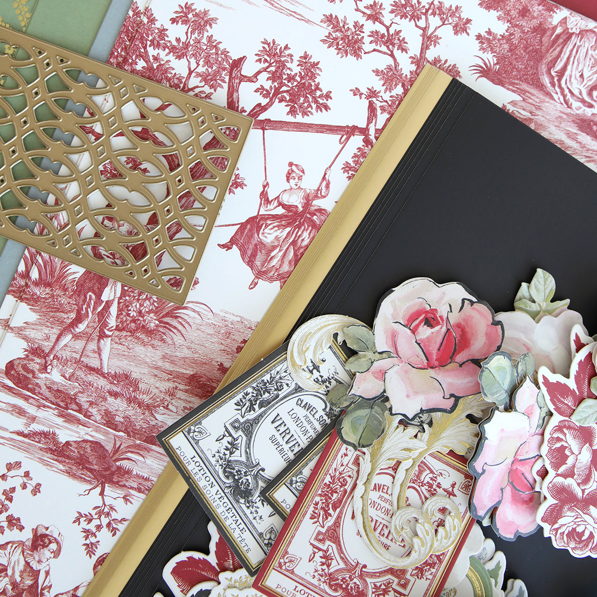 A gift-wrapped Anna Griffin Perfume Box Class Materials and Dies adorned with delicate rose designs.