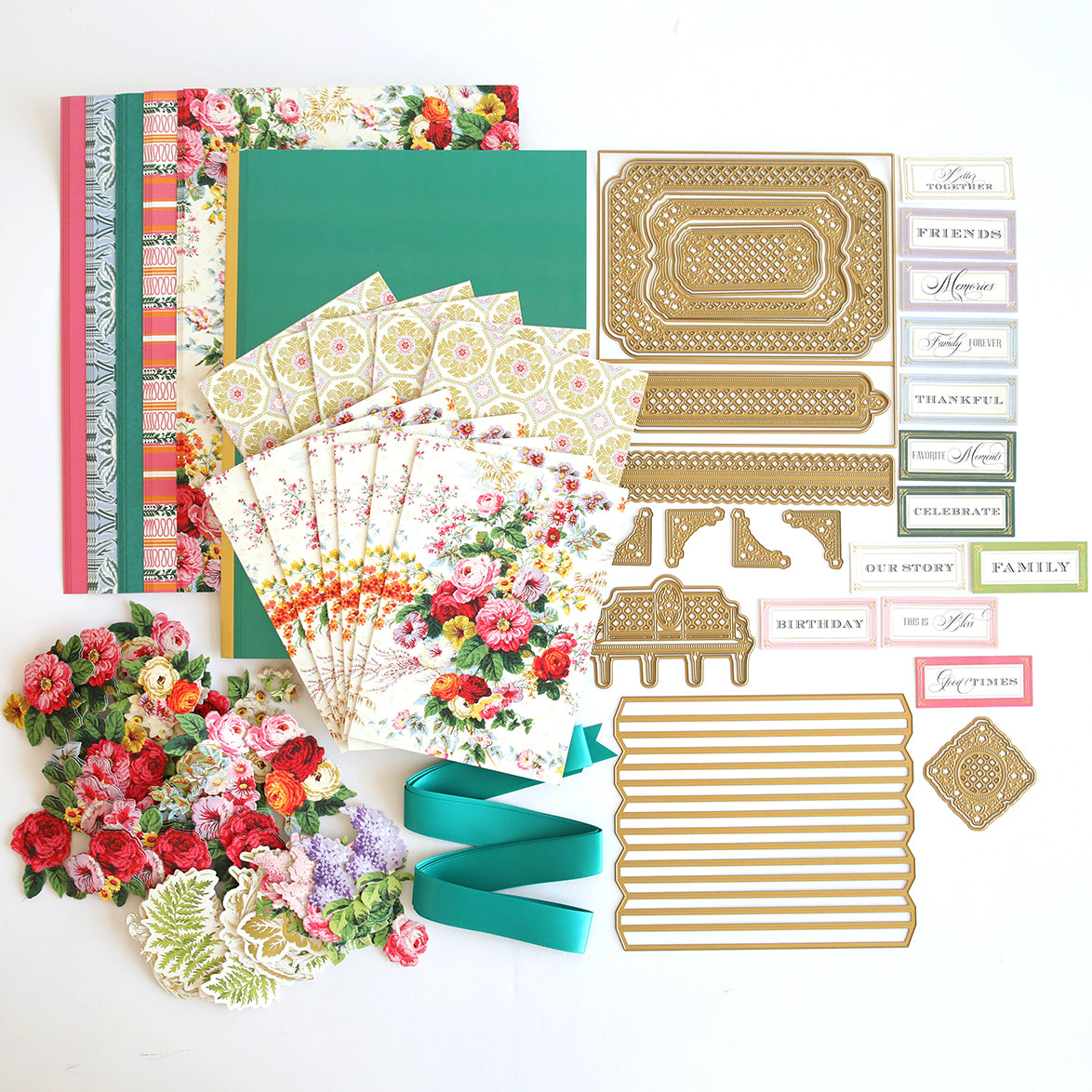 A memory collection of papers, ribbons, and embellishments on a white surface, featuring Anna Griffin's Trellis Album Class Materials and Dies.