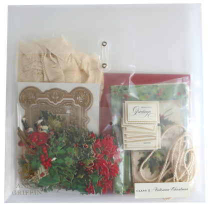 A clear plastic bag with holly, ribbon and Victorian Christmas Class Materials and Dies.