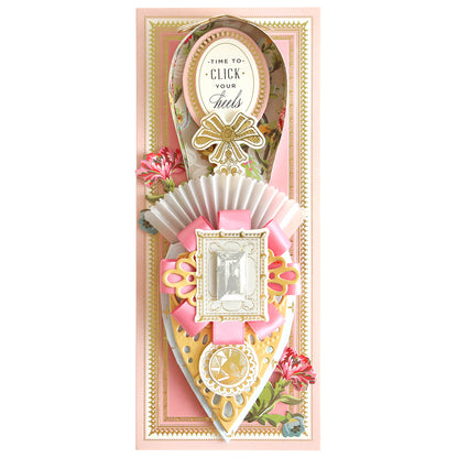 Elaborately designed bookmark with a "time to click your heels" quote, incorporating fancy paper shoe dies and clock motifs with floral accents.