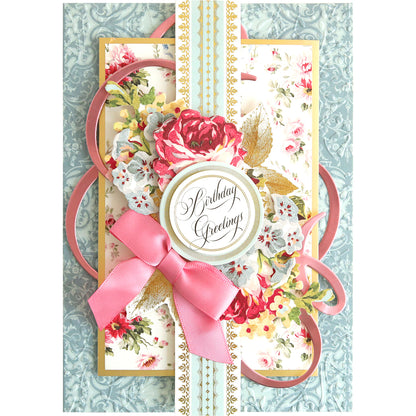A Flourish Die Bundle with a pink ribbon and decorative flower details. Perfect for cardmaking projects.