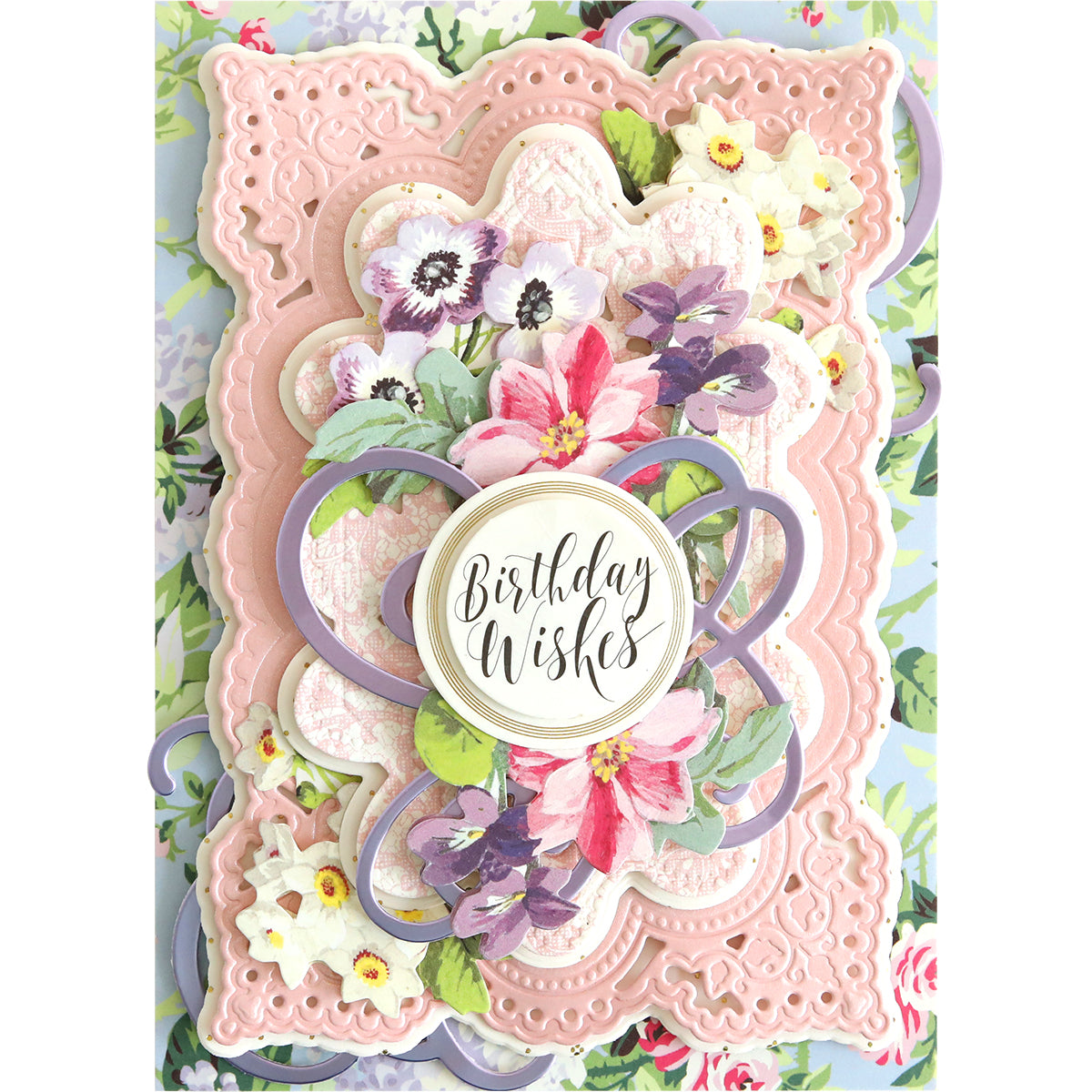 A fancy Flourish Die Bundle with decorative details, perfect for cardmaking projects, featuring pink and white flowers.