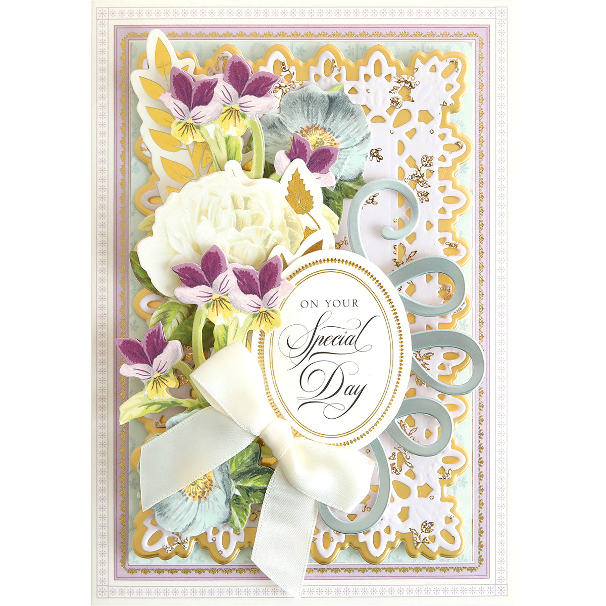A fancy Flourish Die Bundle adorned with decorative details such as flowers and a bow, perfect for cardmaking projects.