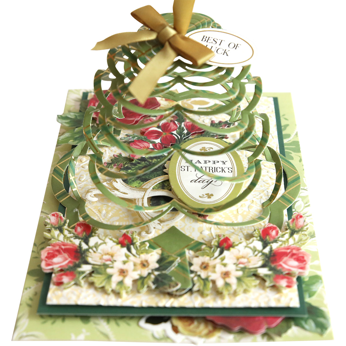 A beautiful Christmas tree pop up card with a ribbon and bow created using the Shamrock Kirigami Dies.