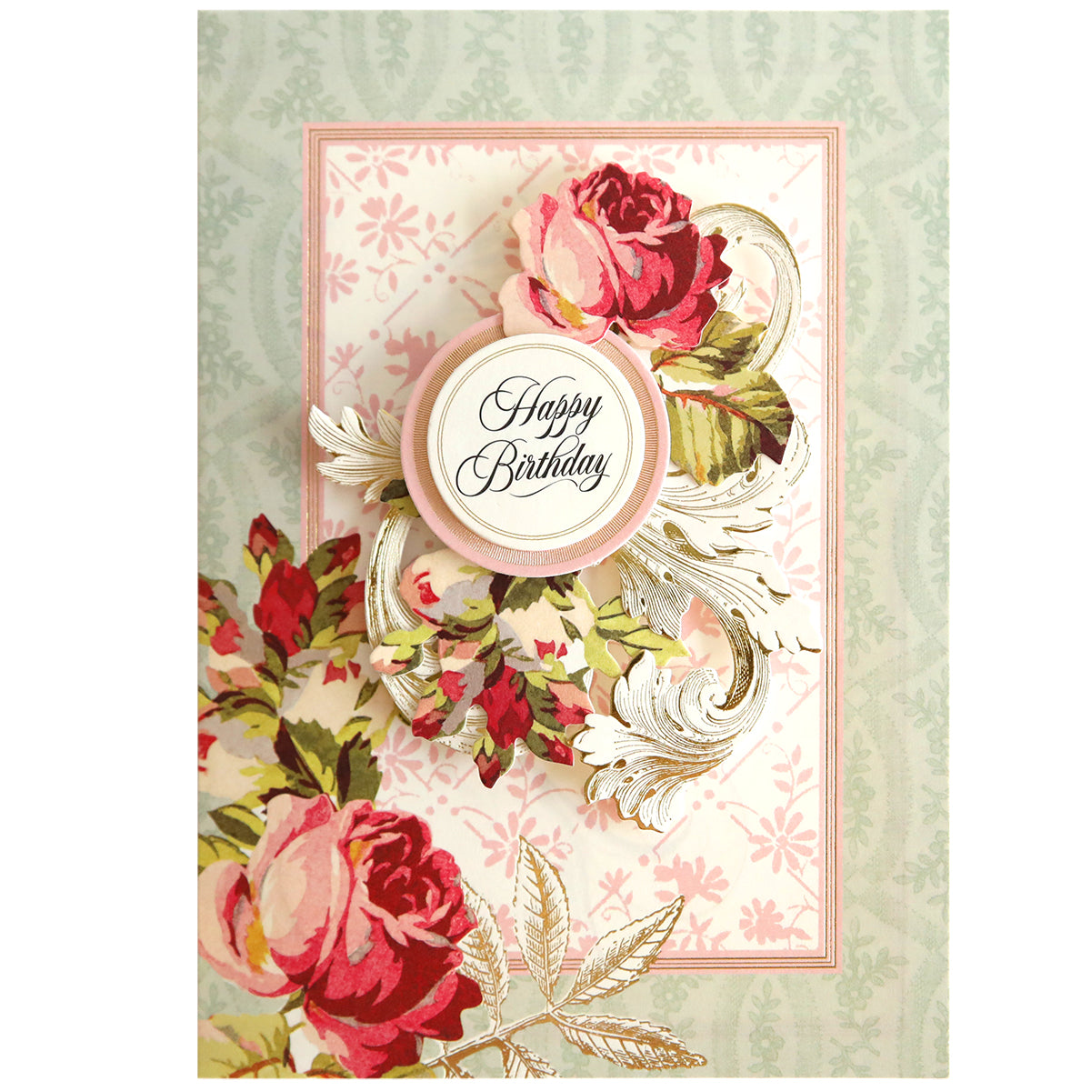 A handmade birthday card from the Folded Flower Birthday Card Kit, featuring floral designs and a central circle with "happy birthday" text, embellished with metallic accents.