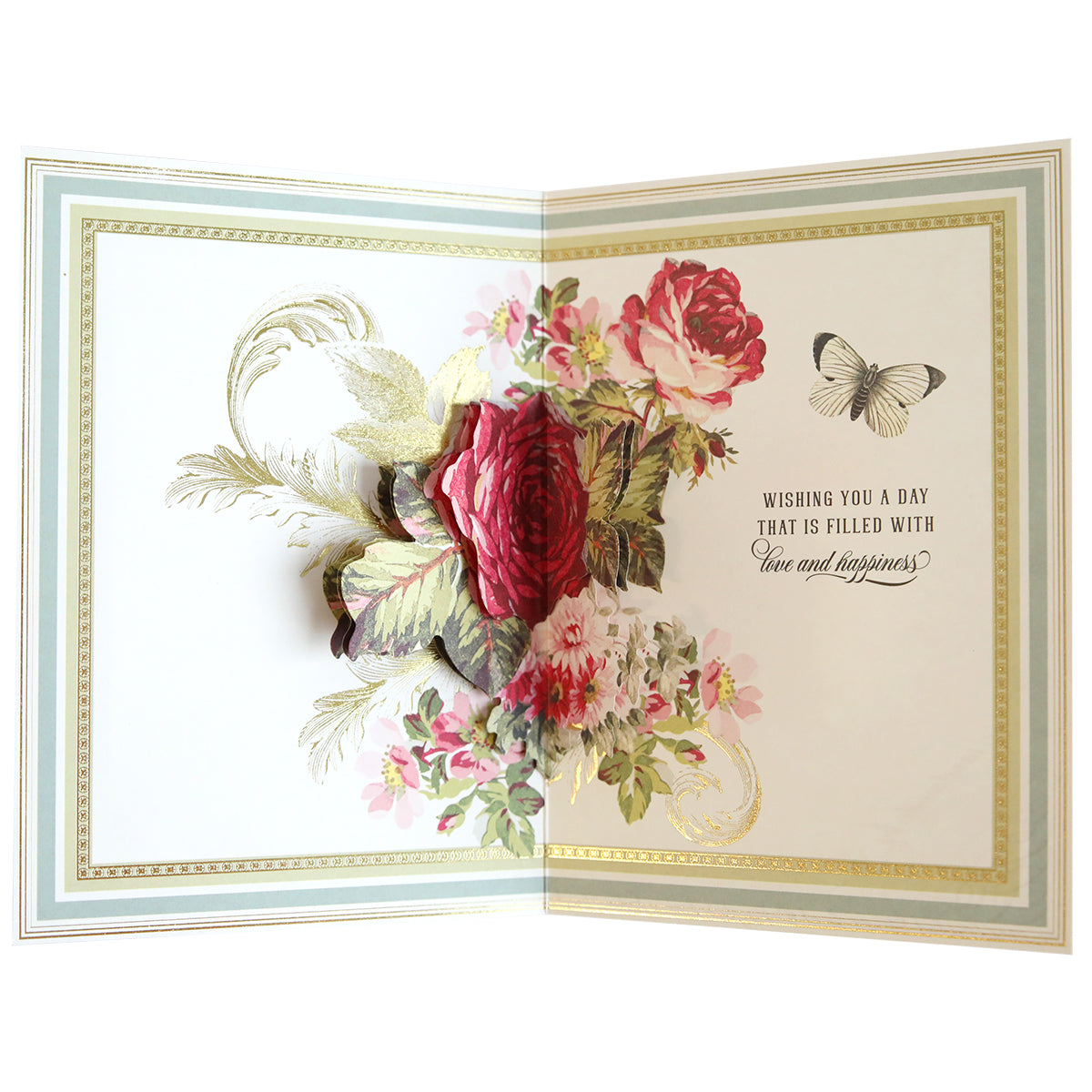 An open greeting card from the Folded Flower Birthday Card Kit featuring a 3D pop-up bouquet of red roses and feathers with the message "Wishing you a day that is filled with love and happiness.