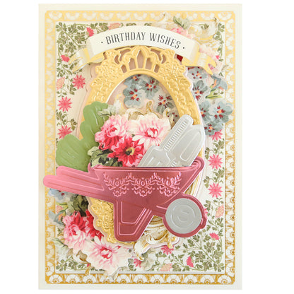 An ornate birthday card with floral patterns and embellishments, including a Garden Icons Cut and Emboss Folders decoration under a "birthday wishes" banner.