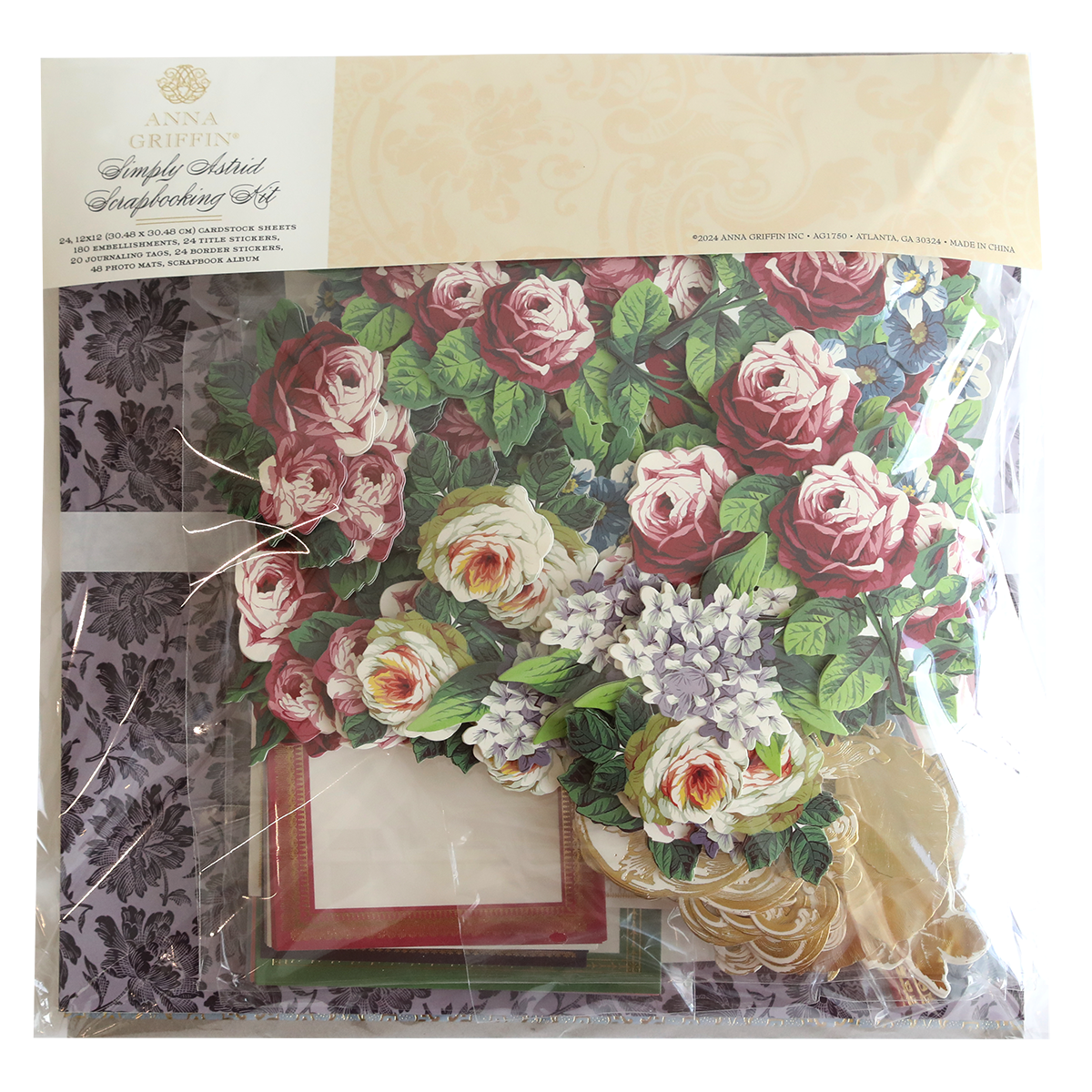 A packaged set of Simply Astrid Scrapbooking Kit, featuring floral designs, frames, and materials for creating customized cards.