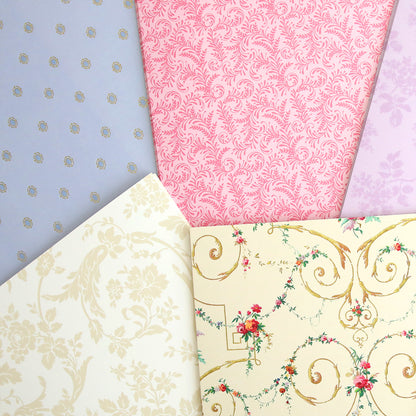 An assortment of decorative wallpapers with various patterns and colors from Astrid 8x12 Doublesided 300gsm Cardstock design.