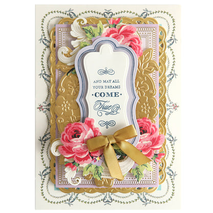 Elaborate greeting card with 3D floral designs, gold accents, and a central message framed with a yellow ribbon using Fantastic Sentiment Stamps and Dies.