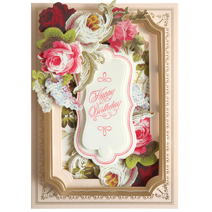 An ornate birthday card with a 3D floral design created using Fantastic Sentiment Stamps and Dies, and a central plaque reading "happy birthday" in cursive script, framed in gold.