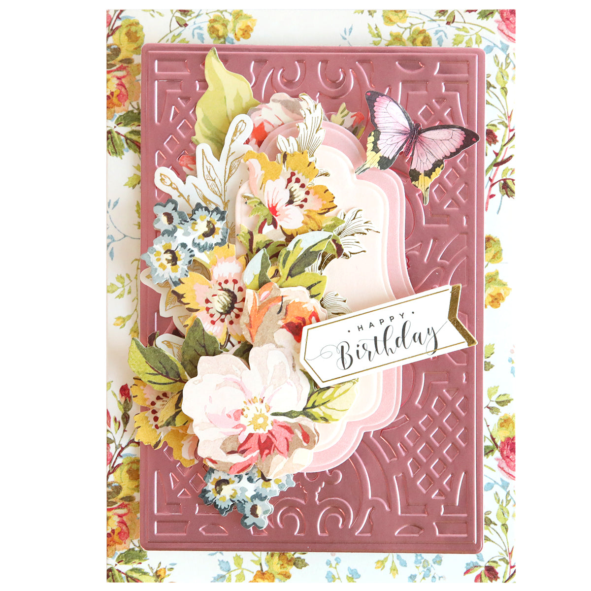 Handcrafted birthday card with a 3D floral design created using Card Layer Cut & Emboss Folders, featuring a "happy birthday" tag on a textured pink background.