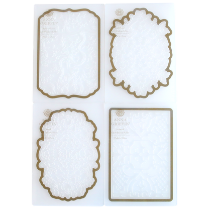 Four ornate die-cut paper frames in different shapes, with decorative embossed patterns from Card Layer Cut & Emboss Folders and brown borders, displayed on a white background.