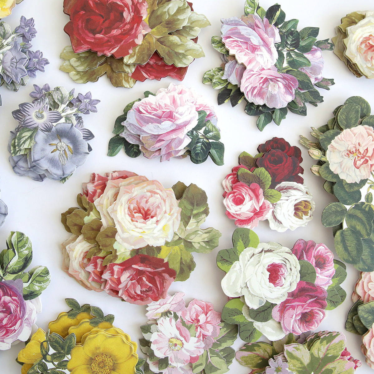 Various Anniversary Floral Stickers, including roses and peonies, are scattered on a white background.