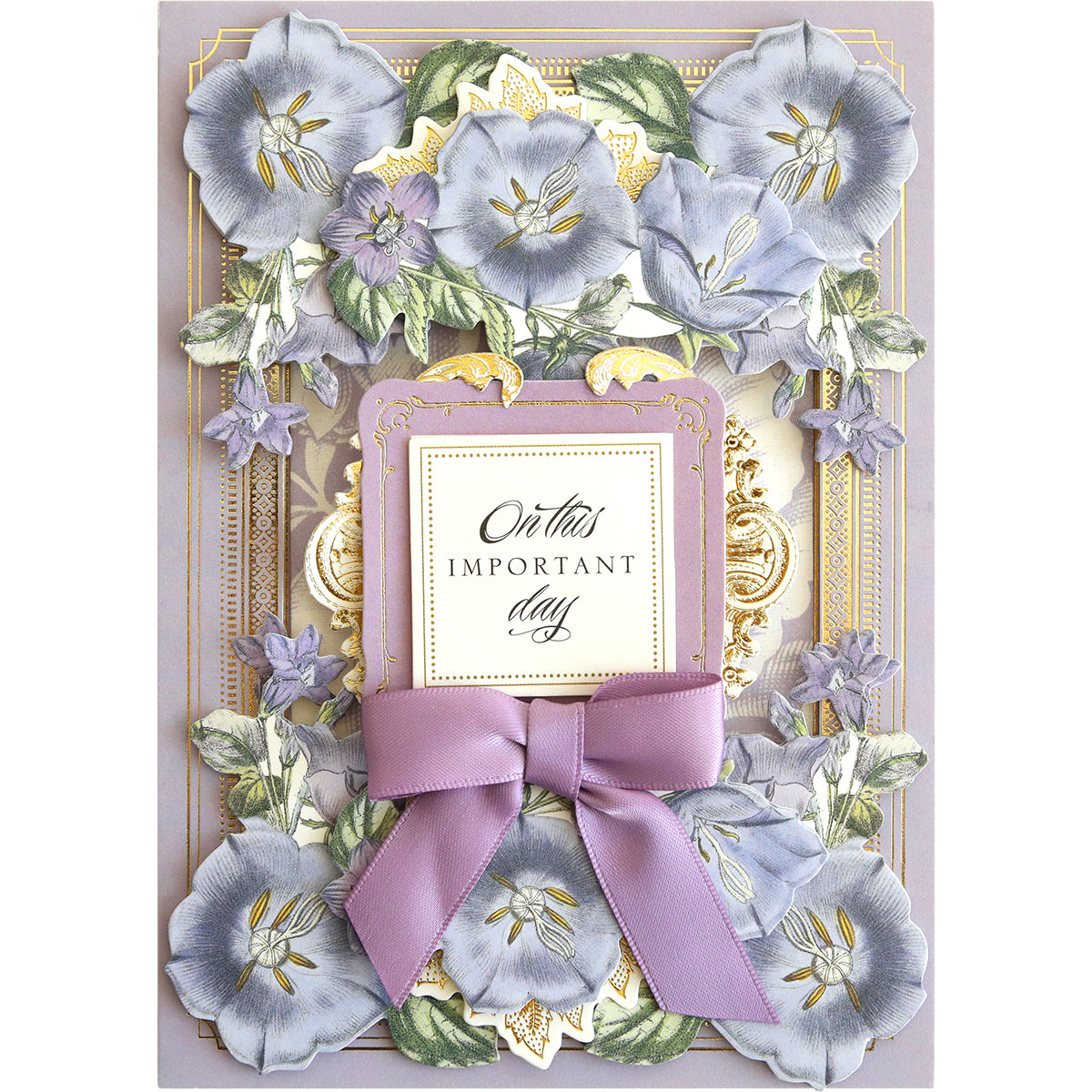 A decorative card with the text "On this important day" in the center, surrounded by Anniversary Floral Stickers and foliage, and adorned with a purple ribbon at the bottom.