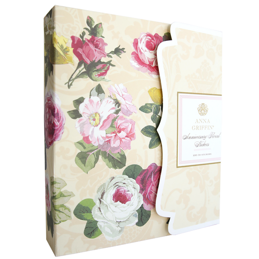 A decorative box with floral designs on a beige background. The box has a label that reads "Anna Griffin" and "Anniversary Floral Stickers.