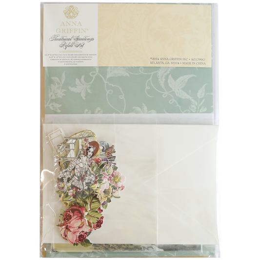 The Theatrical Greetings Refill Kit includes a stationery set featuring floral designs, envelopes, and decorative embellishments in a clear package.