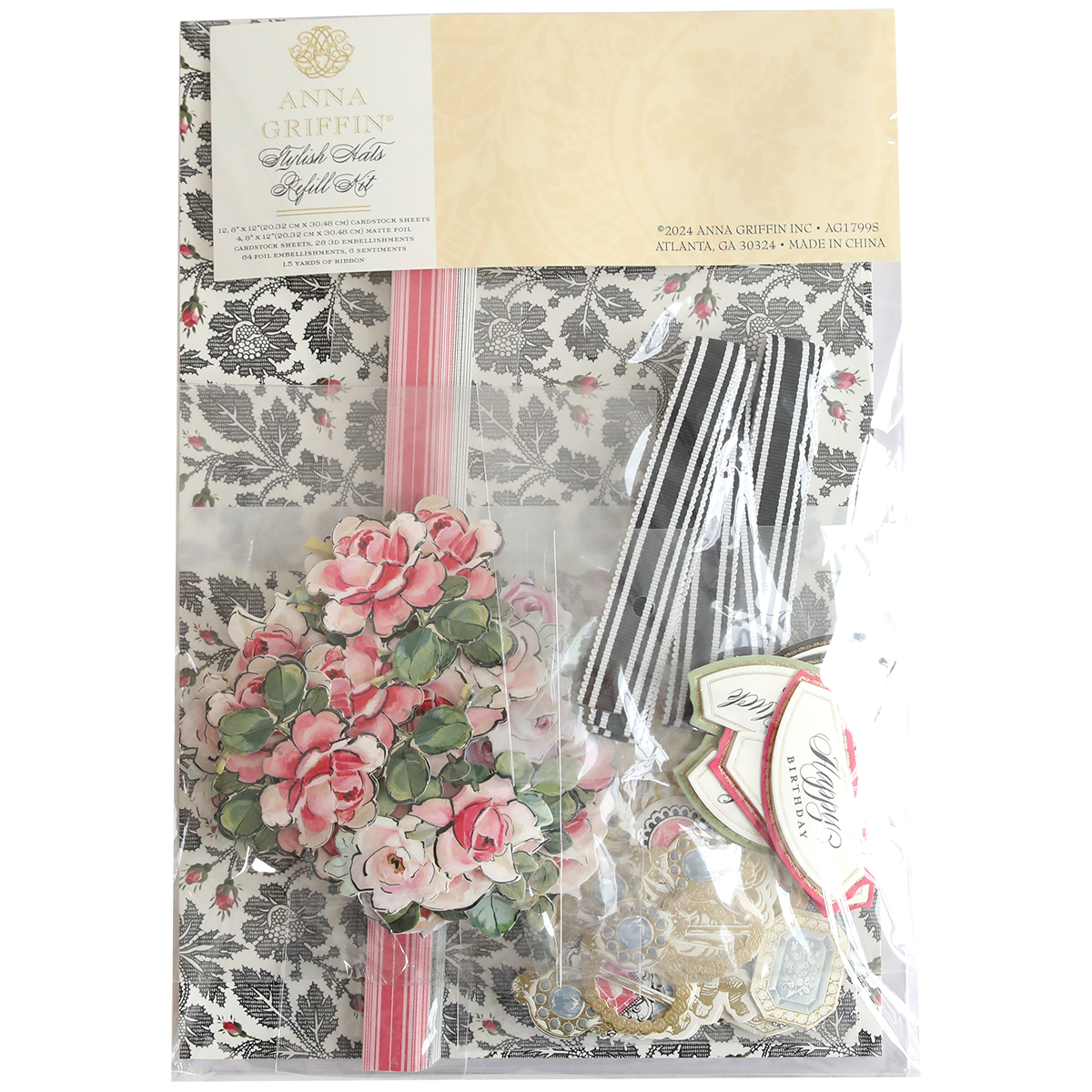 A decorative kit called the "Stylish Hats Refill Kit" includes floral-patterned paper, pink flowers, striped ribbon, and various tags in a clear package.