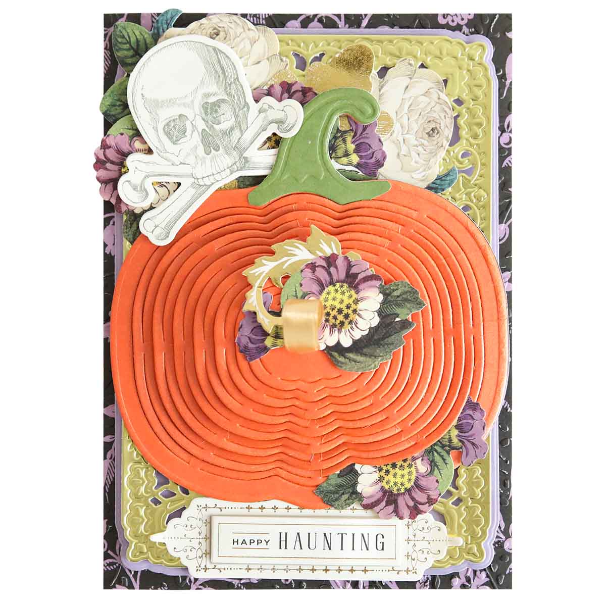 Layered card made with Pumpkin Patch Kirigami Dies and Foil Cardstock—features a large orange pumpkin, floral accents, skull and crossbones, and “Happy Haunting” label.