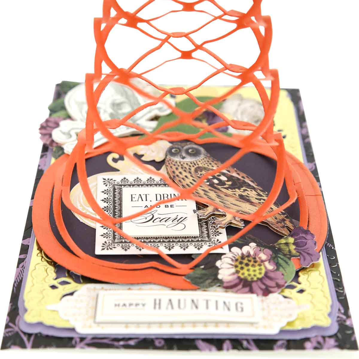 The Pumpkin Patch Kirigami Dies and Foil Cardstock creates a handmade Halloween card with an owl, flowers, pop-up web, and festive labels.