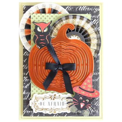 Handmade Halloween card featuring a layered orange pumpkin using Pumpkin Patch Kirigami Dies and Foil Cardstock, black ribbon, owl, witch-hat cat, rosettes, and “Be Afraid” text.
