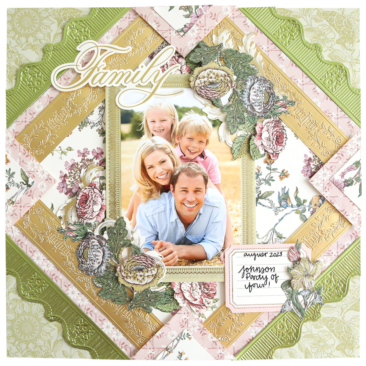 A beautifully designed scrapbook page displays a family photo encircled by elaborate floral patterns and elegant borders created with the 12" Cut and Emboss Folder Autoship. The stylish decorative fonts highlight the words "Family" and "August 2023, Johnson Family of four!" adding charm to this unforgettable keepsake.