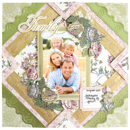 A beautifully designed scrapbook page displays a family photo encircled by elaborate floral patterns and elegant borders created with the 12" Cut and Emboss Folder Autoship. The stylish decorative fonts highlight the words "Family" and "August 2023, Johnson Family of four!" adding charm to this unforgettable keepsake.