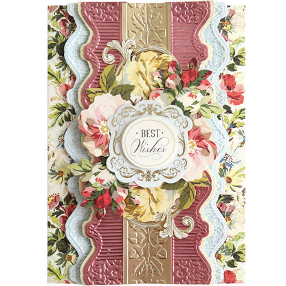 The 12" Cut and Emboss Folder Autoship features exquisite decorative elements, including an embossed pattern and floral design. The central text of "Best Wishes," surrounded by pink, yellow, and red flowers, makes it perfect for adding charm to scrapbook pages.