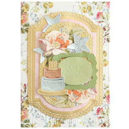 The Celebrations 3D Embellishment Dies create a decorative greeting card with floral patterns, gold borders, and an ornate design featuring a cake and the text "Let's Celebrate" in the center, perfect for a variety of occasions.