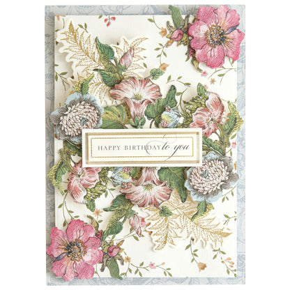 A birthday card featuring "Happy Birthday to you" centered and surrounded by intricate, colorful designs from the Wildflower Meadow Stickers, showcasing pink, green, and white petals.