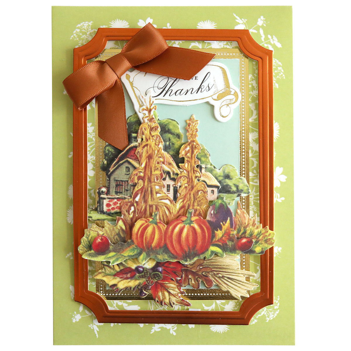 A greeting card with a "Give Thanks" message, featuring a bow, pumpkins, and a scenic autumn farm illustration on a green floral background, all accentuated with Harvest Embellishment Stickers for added rustic charm.