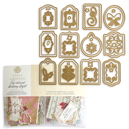 Creative Birthday Tags and Dies: twelve gold-colored metal cutting dies arranged in three rows above a package of birthday gift tags and floral embellishments.