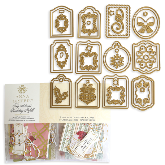 Creative Birthday Tags and Dies: twelve gold-colored metal cutting dies arranged in three rows above a package of birthday gift tags and floral embellishments.