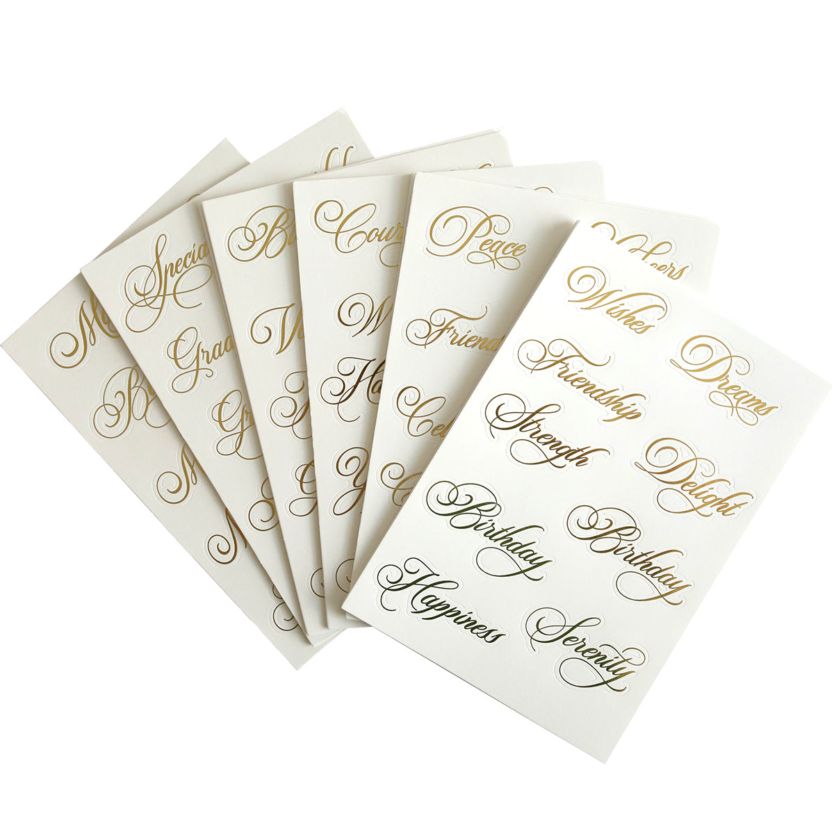 The Perfect Title Stickers, featuring several white cards with gold cursive text displaying positive words like "Peace," "Friendship," and "Serenity," are ready to adorn your scrapbook pages.