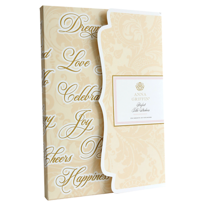 A cream-colored box with decorative text contains 24 sheets of stickers from Anna Griffin, titled "Perfect Title Stickers," perfect for embellishing scrapbook pages.