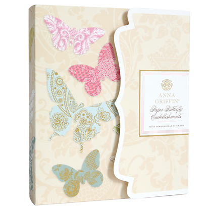 A box of Paper Butterfly Embellishments with coordinating storage folio showcases pink and blue butterfly designs on a beige floral background.