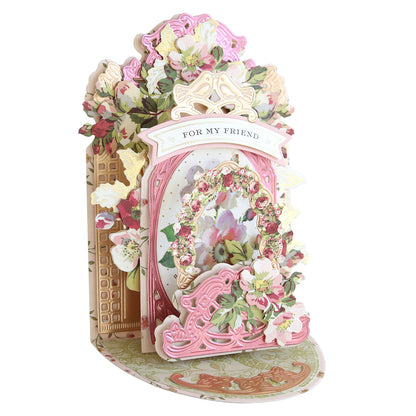 A pop-up card with pink and gold floral details featuring butterflies and "For My Friend" was crafted using the Interactive Pulley Dies, offering a delightful experience with its intricate design.